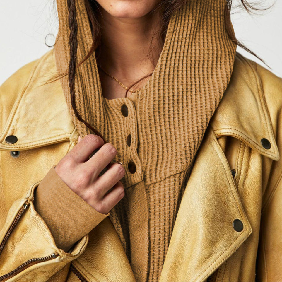 Tan waffle hoodie with zip front and hood, layered close-up view