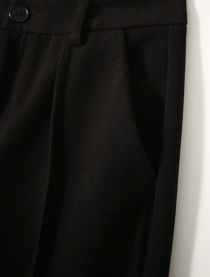 Black high-waisted wool-blend trousers with pleats and button waistband detail