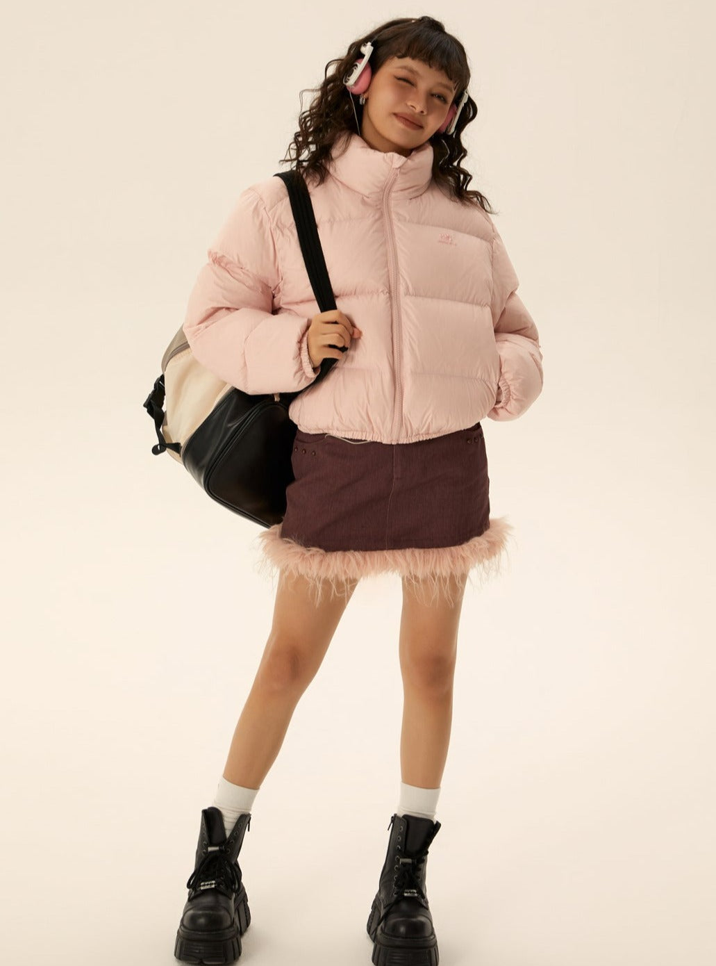 Pink short puffer jacket with zip front and stand collar, padded sleeves