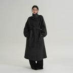 Black funnel-neck wool cocoon coat with tie waist belt and button placket
