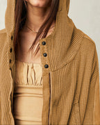 Camel-brown waffle hoodie with hood, front buttons, and zip pocket detail