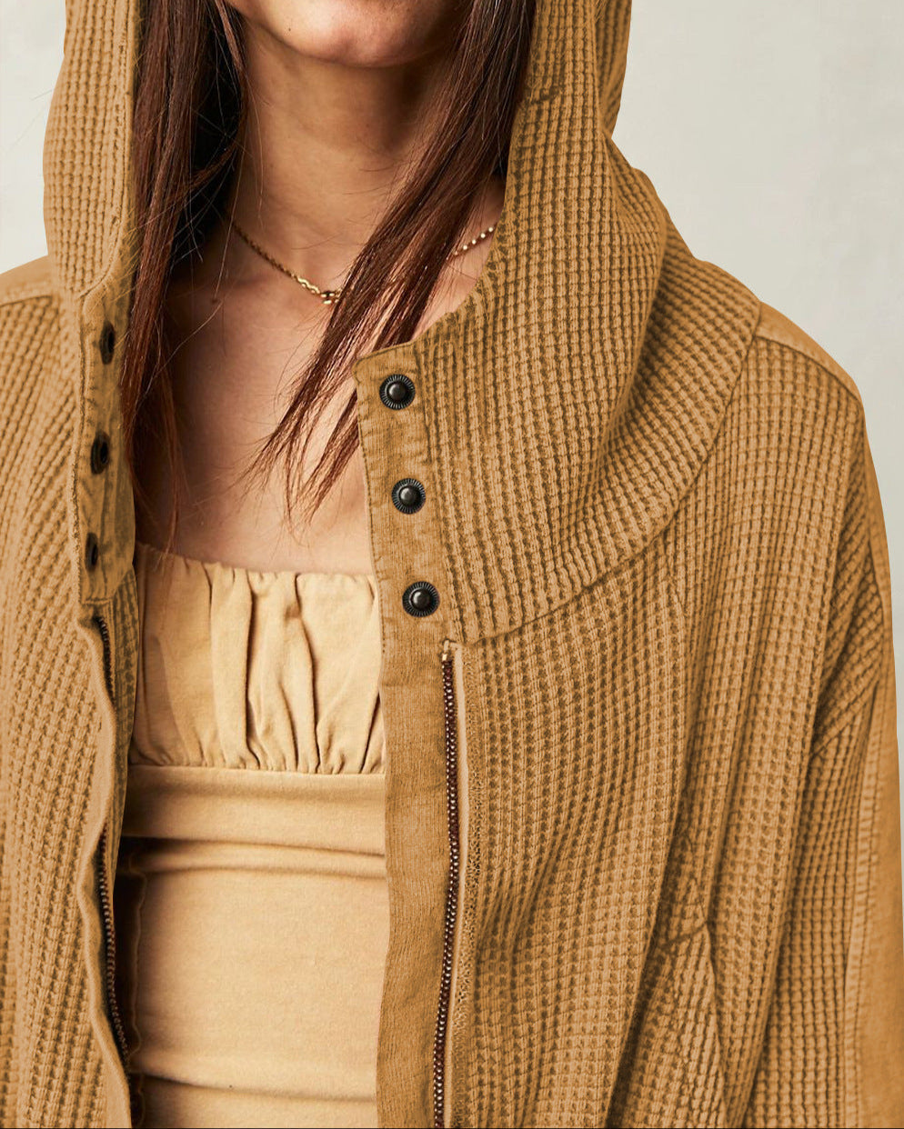 Camel-brown waffle hoodie with hood, front buttons, and zip pocket detail