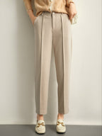 Women’s high-waisted tapered wool-blend trousers, sand beige with belt loops and pleated waist