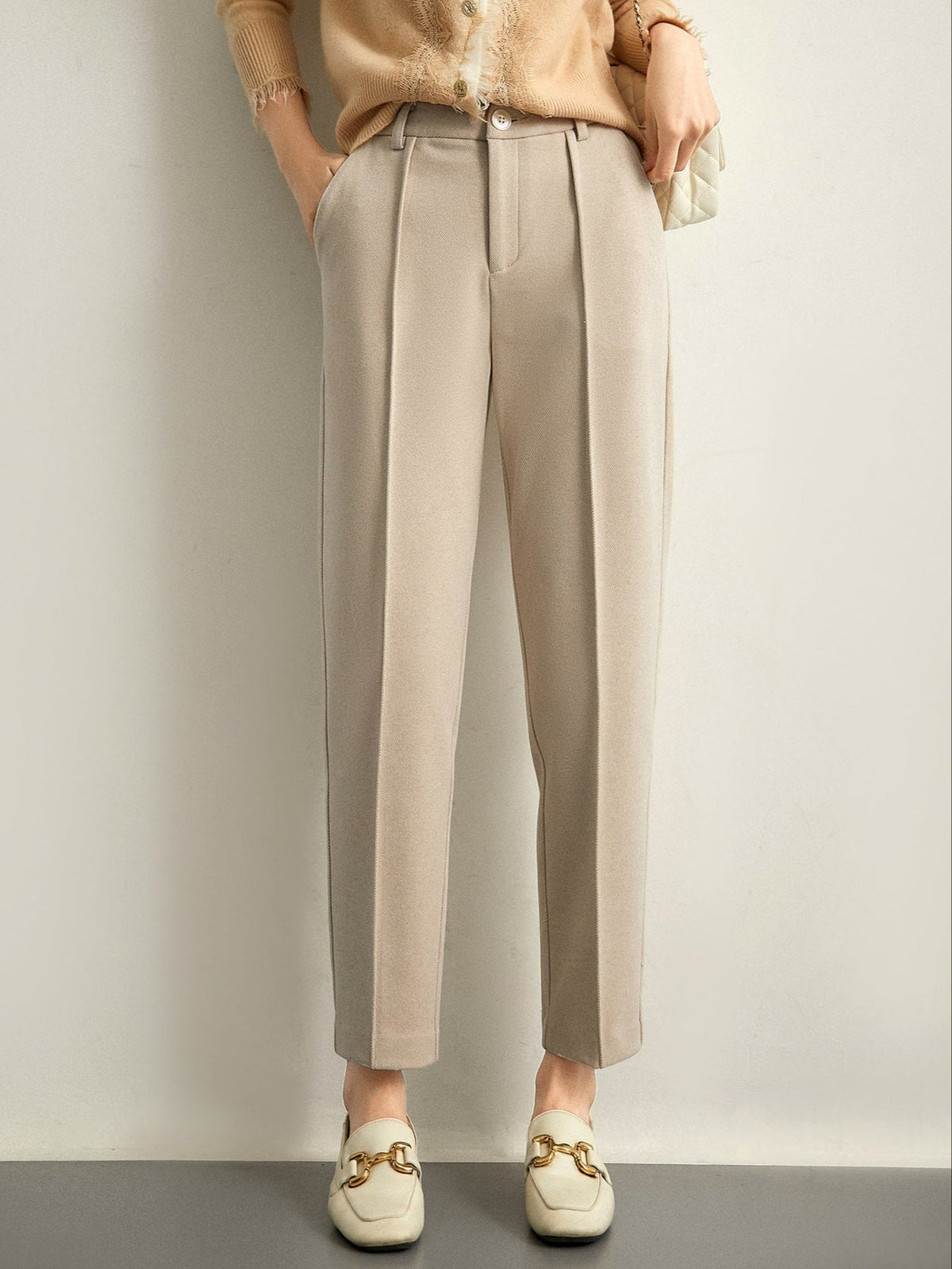 Women’s high-waisted tapered wool-blend trousers, sand beige with belt loops and pleated waist