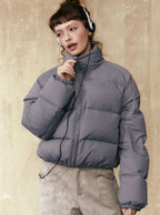 Gray short puffer jacket with full-zip front, stand collar, and long sleeves