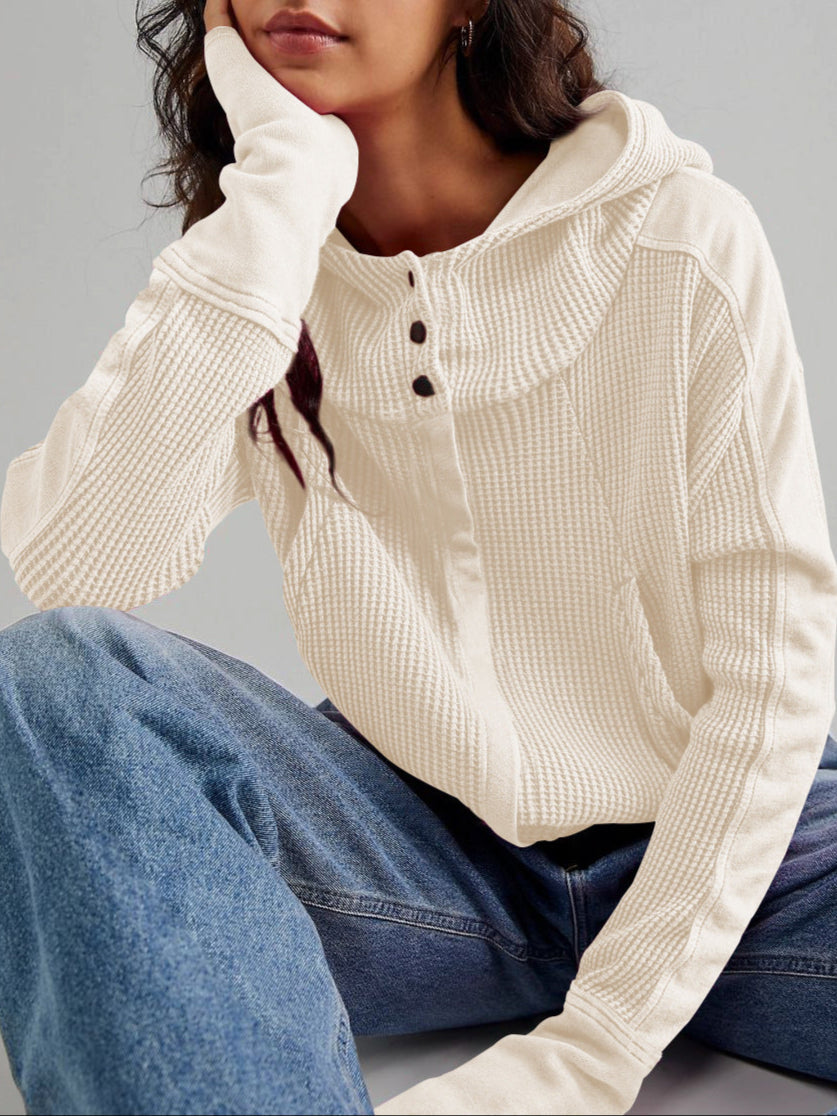Cream waffle zip-up hoodie with hood, snap buttons, and kangaroo pocket