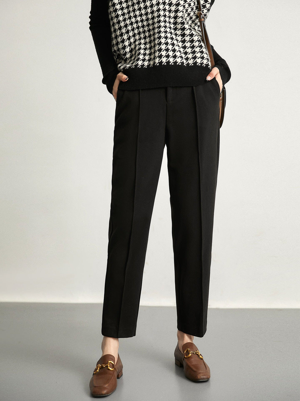 Women’s high-waisted tapered wool-blend trousers, black with belt loops and front crease