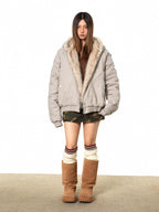 Light gray fur-lined bomber jacket with faux shearling collar and ribbed hem