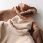 Fuzzy knit turtleneck sweater close-up in brown and cream