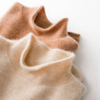 Turtleneck knit sweater close-up showing soft texture in camel and cream