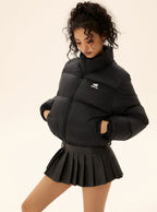 Black short puffer jacket with stand collar, full-zip front, and quilted puff sleeves