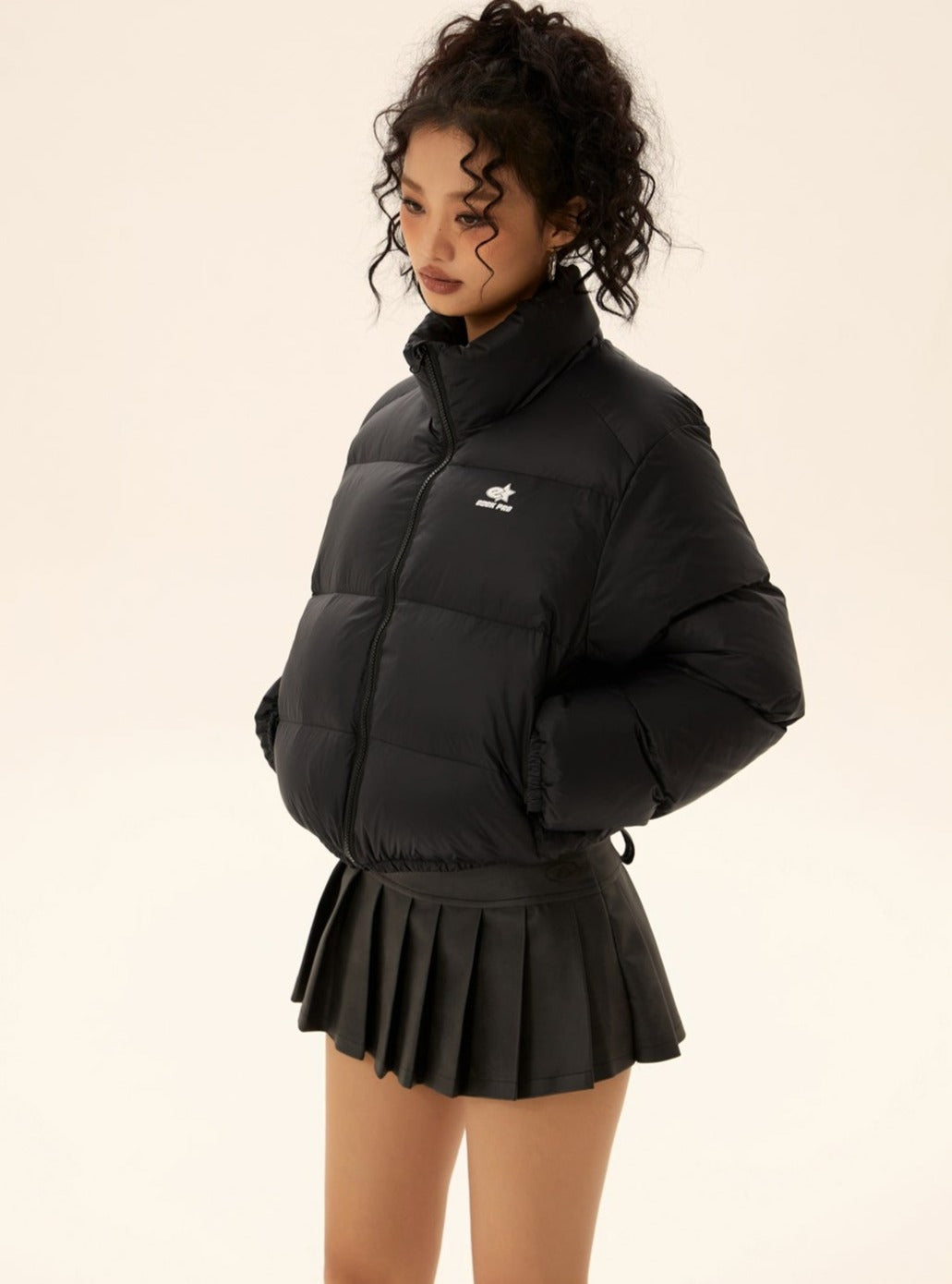 Black short puffer jacket with stand collar and zip front, side pockets