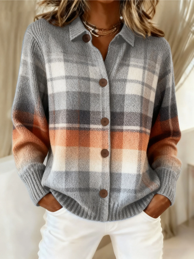 Gray-and-white check knit blouse with collar and button front with dark buttons.