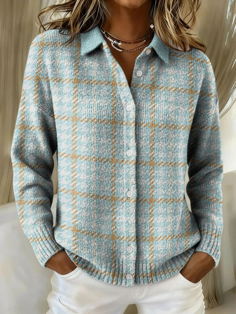 Light blue plaid knit blouse with collar and button front with white buttons.