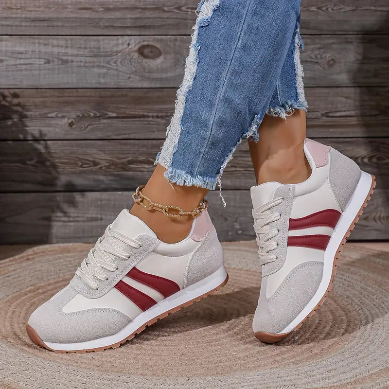 Orthopedic comfort sneakers in white with red stripe detail, lace-up style and rubber sole
