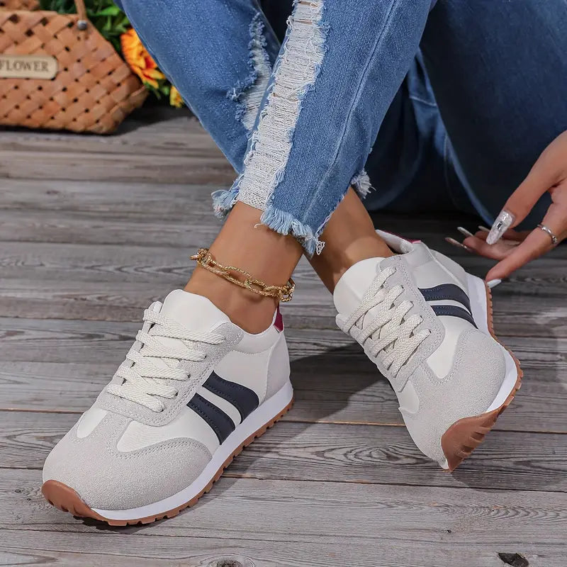 Orthopedic comfort sneakers in white with navy stripe detail, lace-up design and cushioned sole