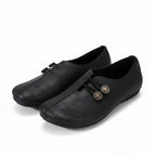 Women’s lightweight walking shoes in black with lace-up front and round coin eyelets