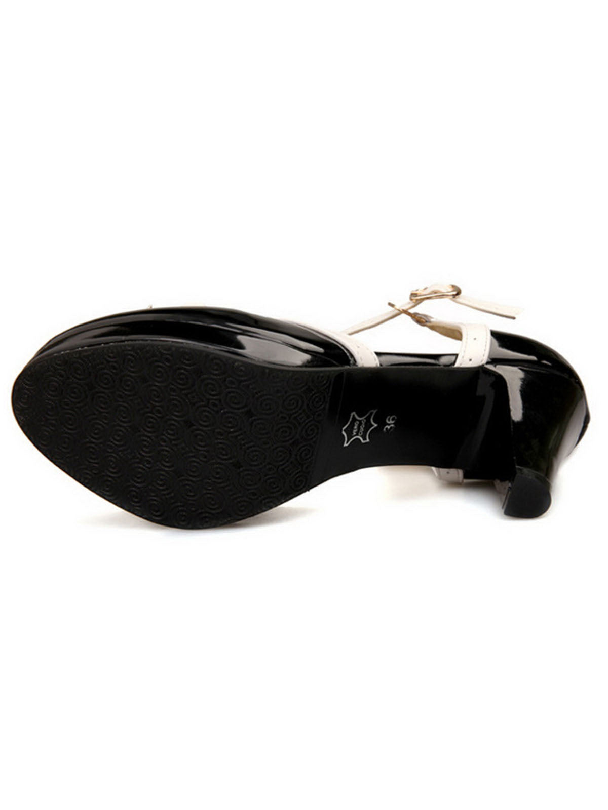 Black high-heel outsoles with patterned tread and visible strap-and-bow details