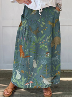 Green A-line pocket skirt with animal-and-floral print, hem detail view.