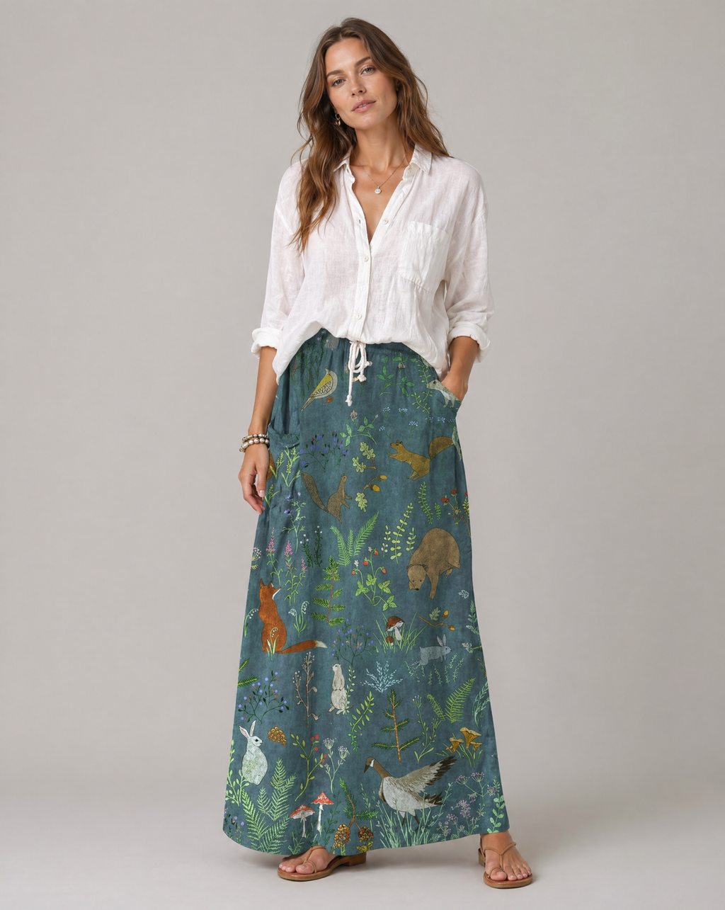 Green A-line pocket skirt with animal-and-floral print, full-length front view.