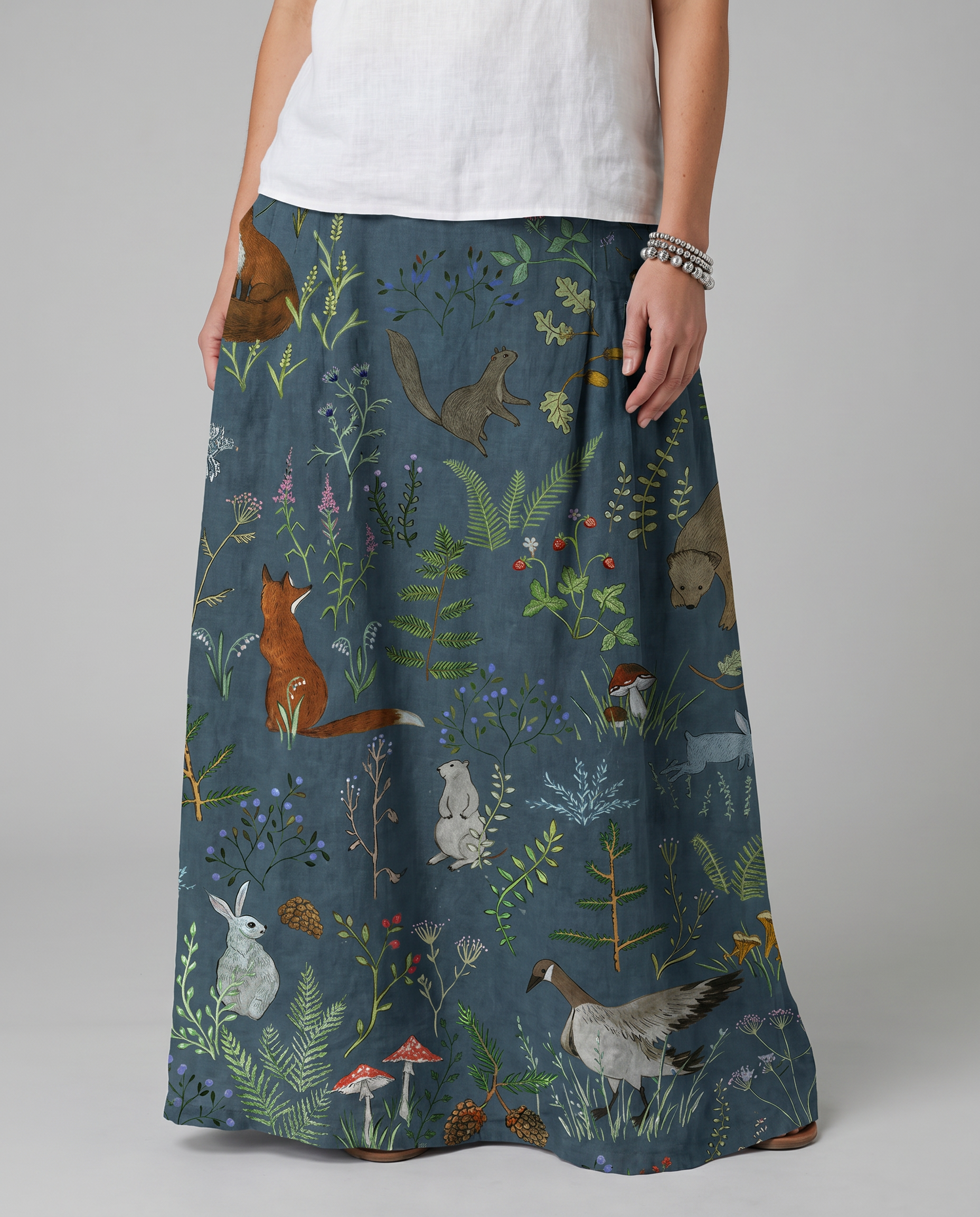 Green A-line pocket skirt with animal-and-floral print, side view to hem.