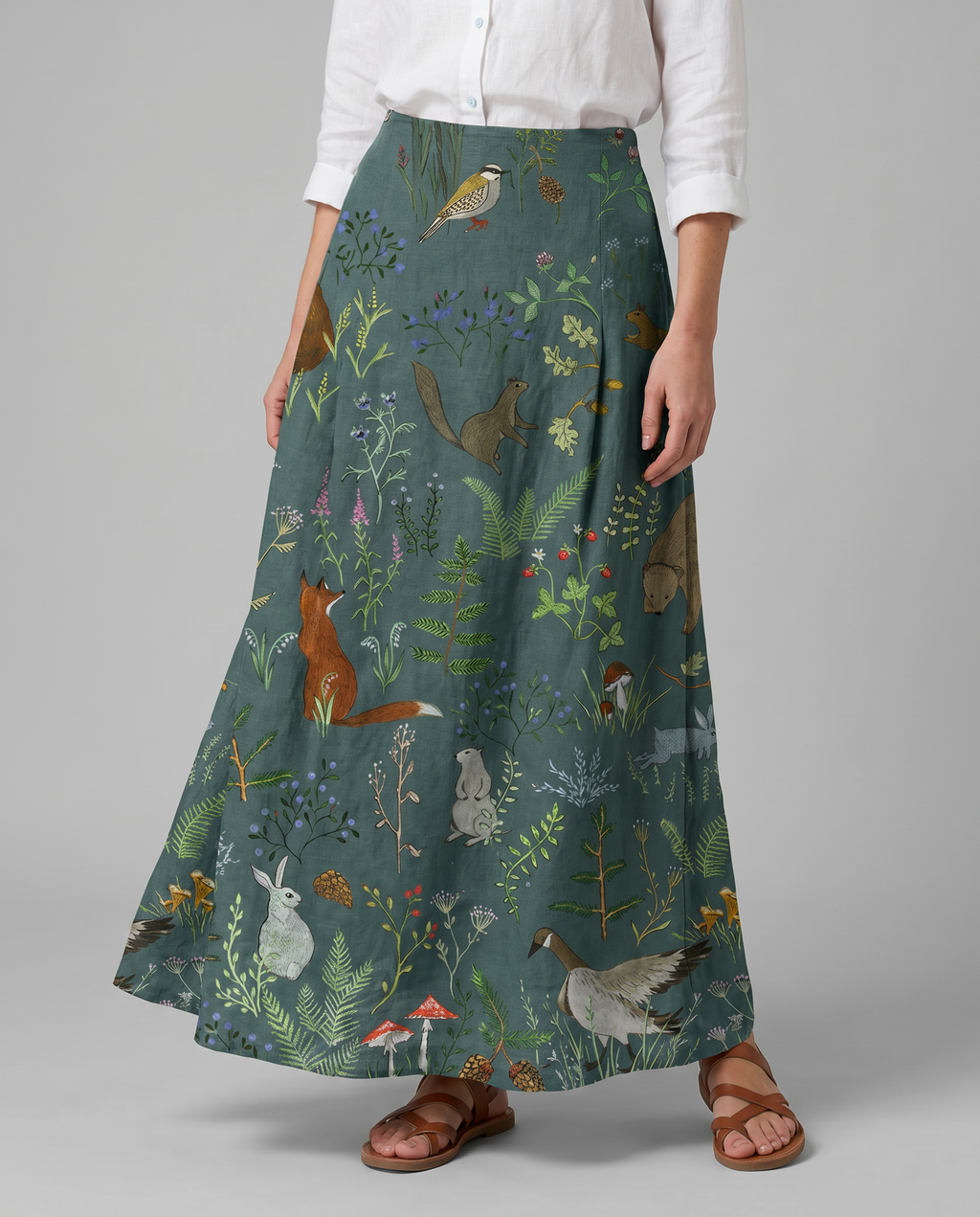 Green A-line pocket skirt with animal-and-floral print, back view.