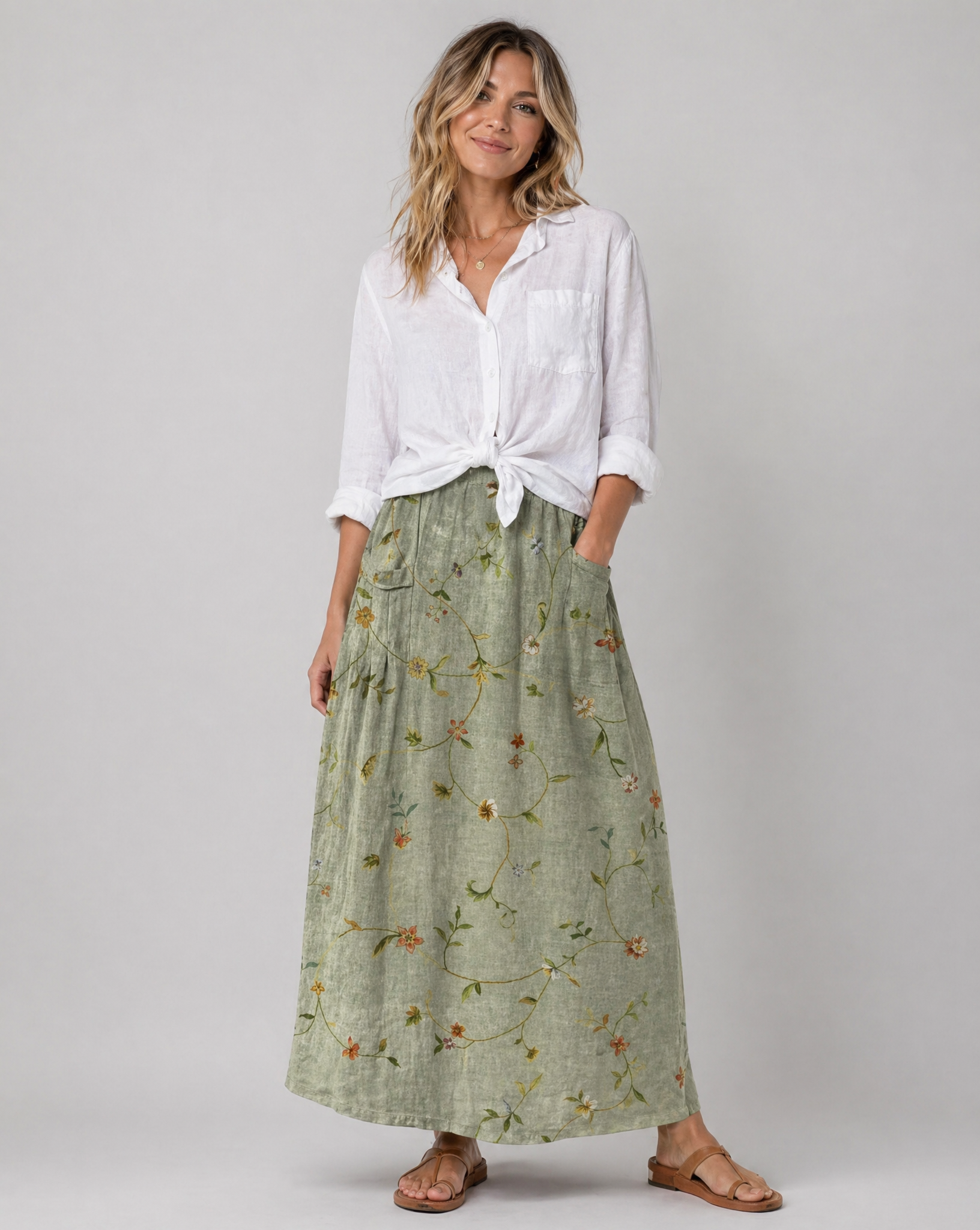 Sage green floral A-line skirt with side pockets and gathered elastic waistband