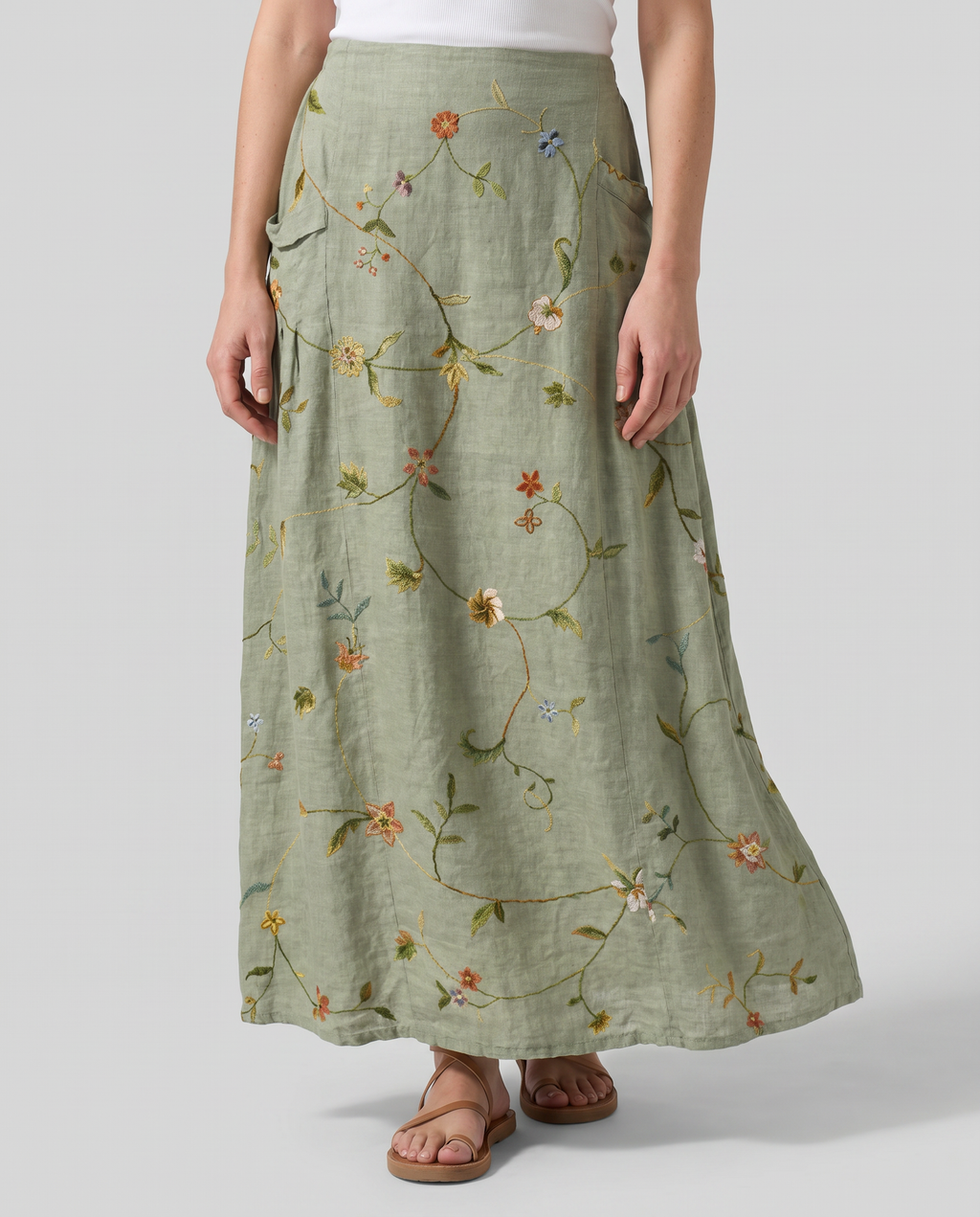 Sage green floral maxi skirt with gathered waist and pleated A-line shape