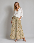 A-line pocket skirt in beige with small retro floral vine print, full length