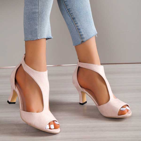 Pink open-toe heeled sandals with ankle strap and mid-height block heel