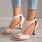 Pink open-toe heeled sandals with slingback strap and block heel