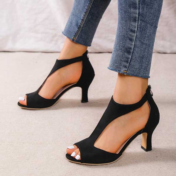 Black open-toe heeled sandals with ankle strap and high block heel