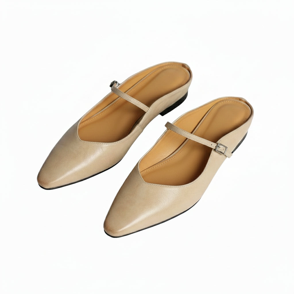 Pair of beige orthopedic leather mules with slingback strap and square buckle detail