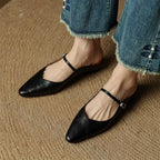 Black orthopedic leather mules with slingback strap and square buckle detail