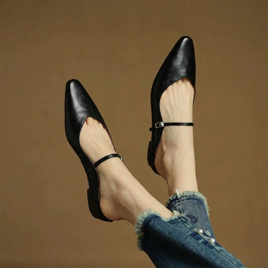 Black orthopedic leather mules with slingback strap and square buckle detail