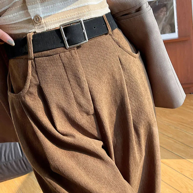 Brown corduroy high-rise wide-leg pants with pleated front and black belt