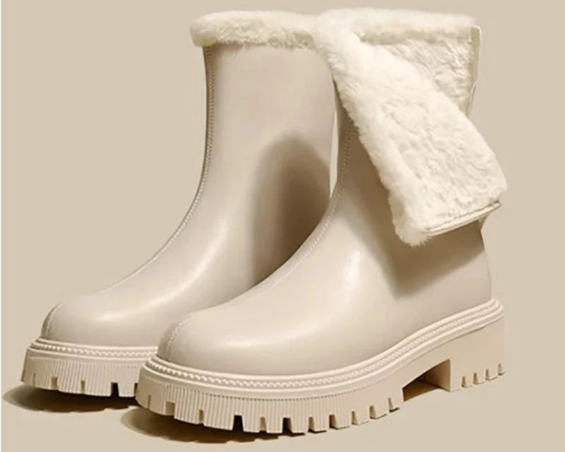 Light beige ankle boots with plush fleece collar and chunky ridged outsole