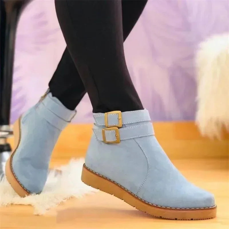 Women’s light blue ankle boots with two buckle straps and low cushioned sole