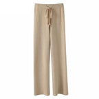 Beige wide-leg lounge pants with high elastic waistband and drawstring tie.