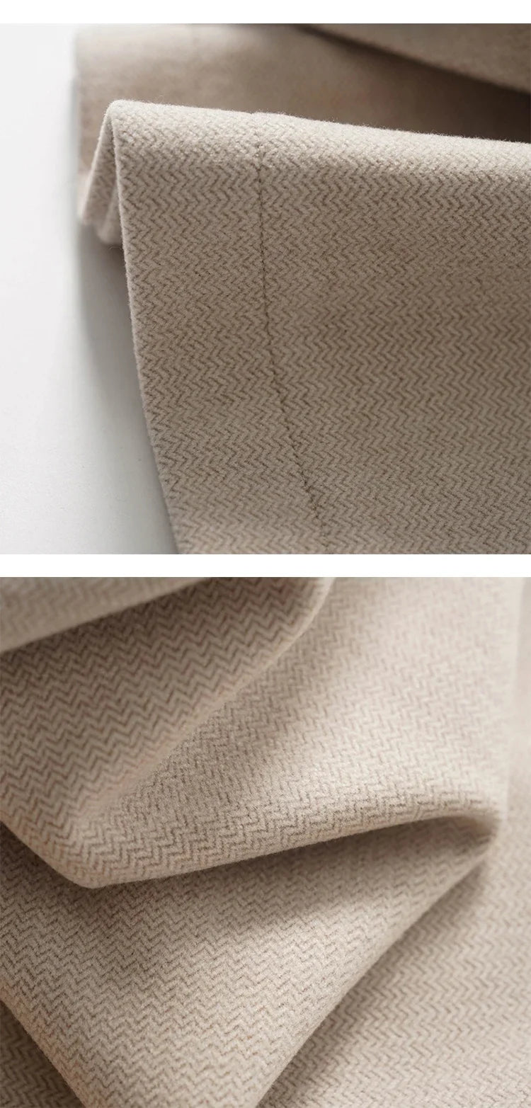 Light beige wide-leg trousers with herringbone texture and clean cuff edge