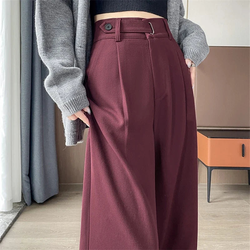 Women's high-rise wide-leg trousers, burgundy with belt loops and pleated front.