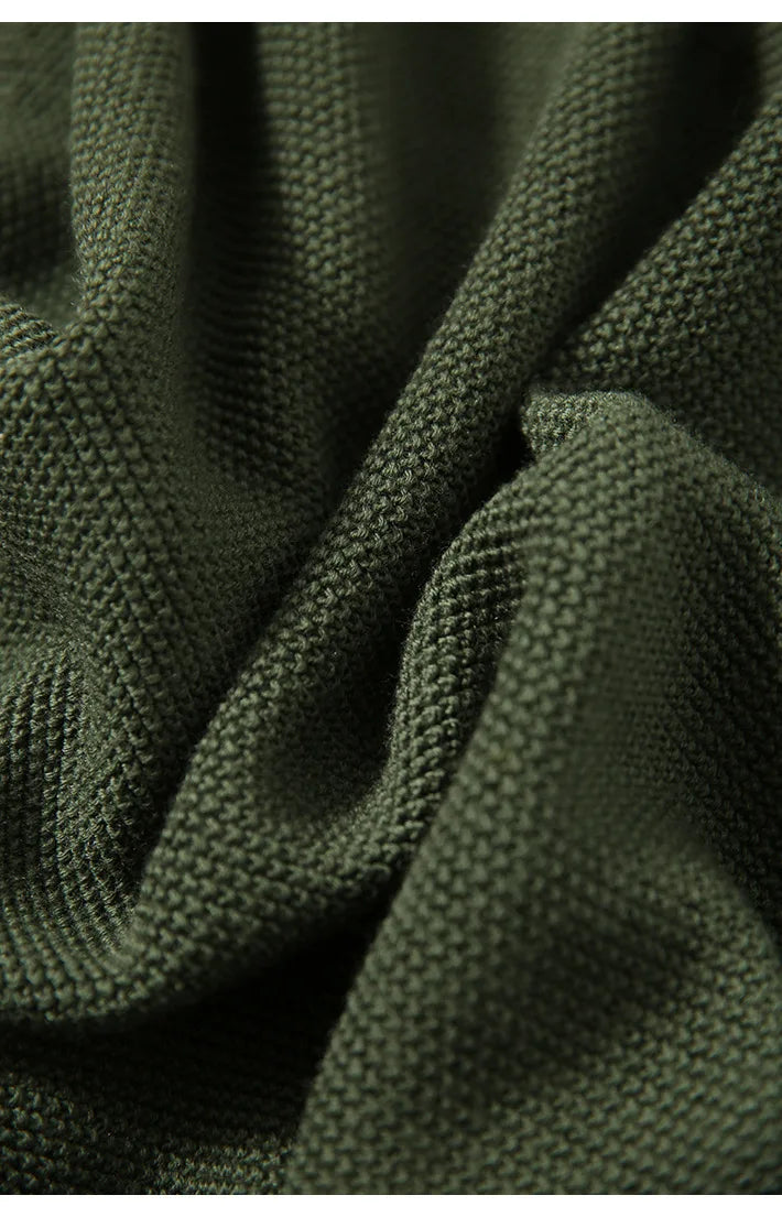 Dark green knit fabric swatch with textured pattern for cardigan.