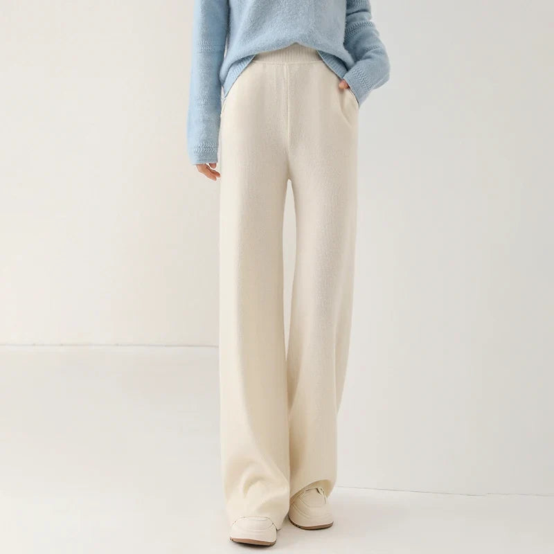 Women’s wide-leg knit pants in cream, side view of smooth, relaxed leg openings