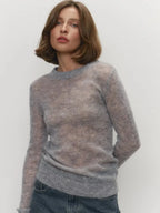 Grey lightweight crewneck knit sweater with long sleeves and ribbed cuffs