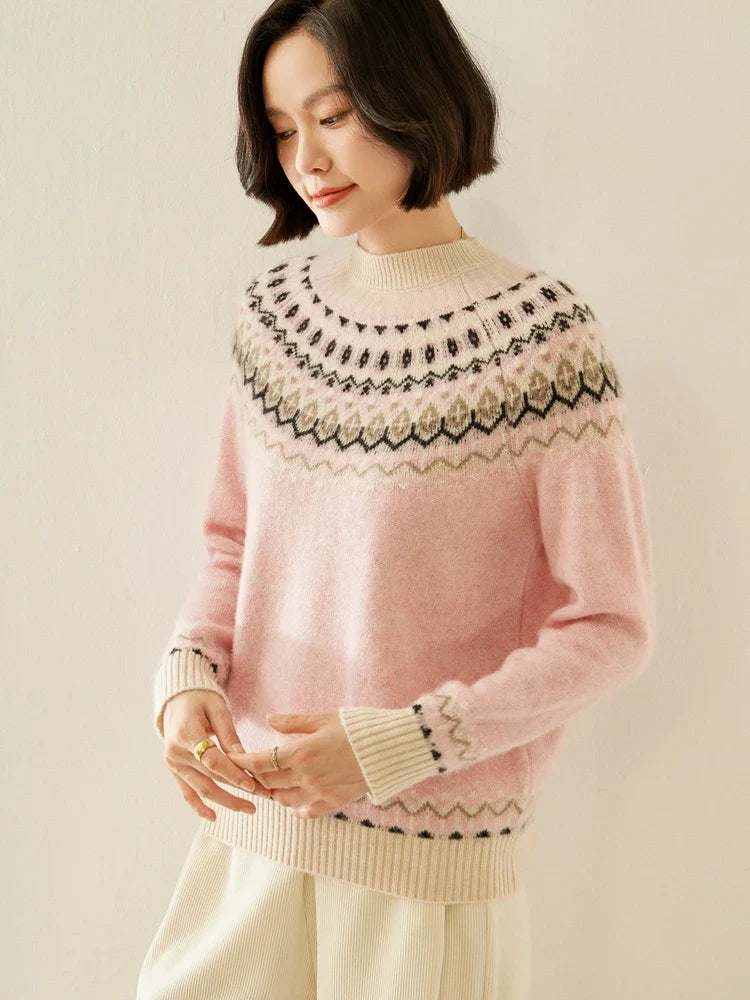 Pink fair isle mock neck knit sweater, hands in front, ribbed cuffs