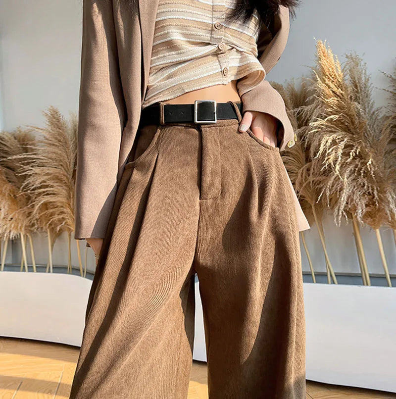 Brown corduroy wide-leg high-rise pants with side pleats and black belt loops