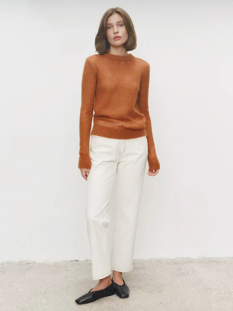 Lightweight crewneck knit sweater in warm brown with long sleeves and ribbed hem.