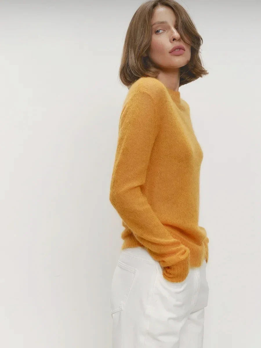 Mustard yellow crewneck knit sweater, side view, long sleeves and ribbed cuffs