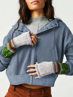 Blue waffle knit zip-up hoodie with button placket and front pockets.
