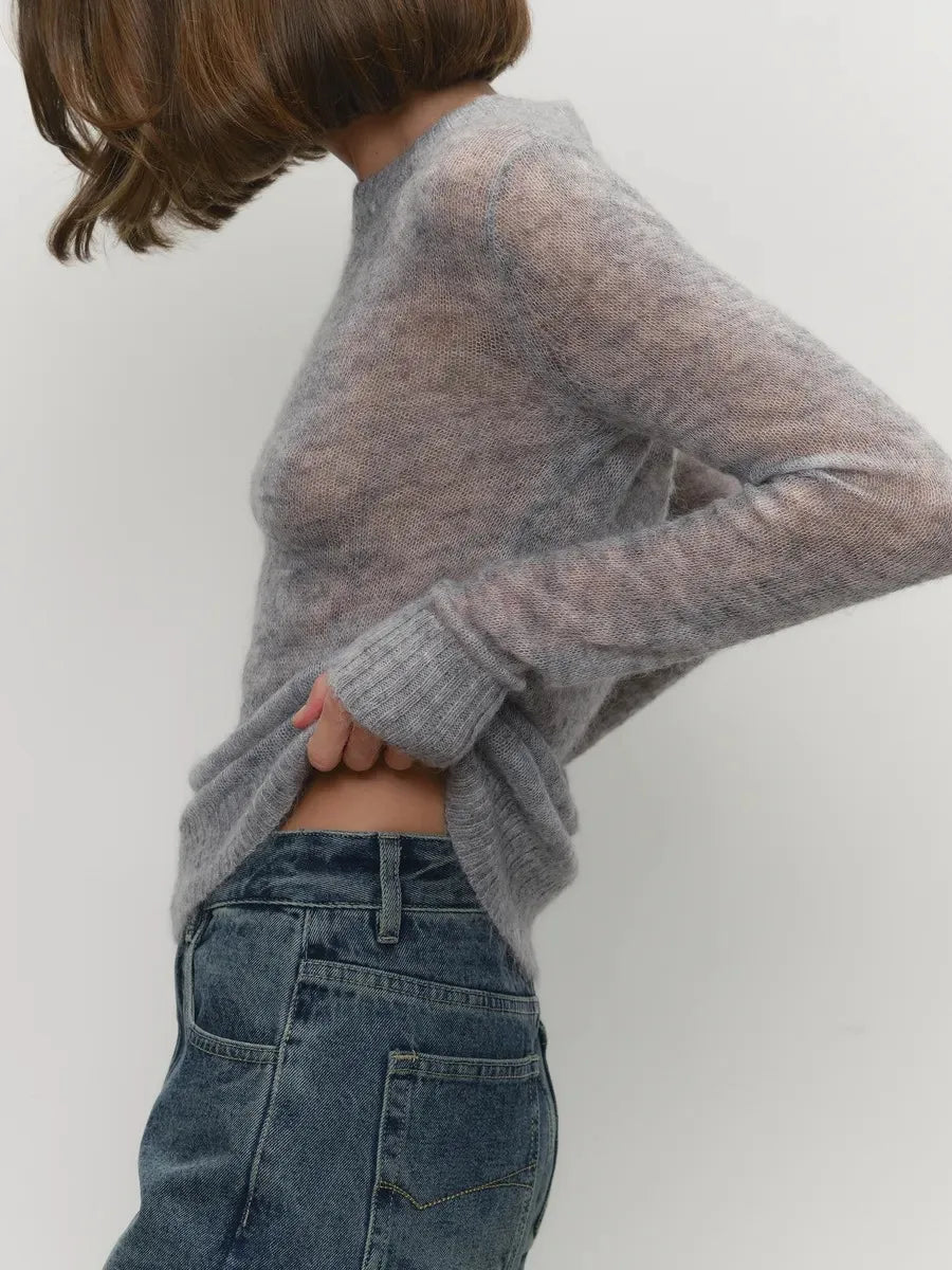 Grey knit sweater back view with long sleeves and ribbed cuff detail